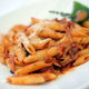 Bowl of penne pasta with red sauce